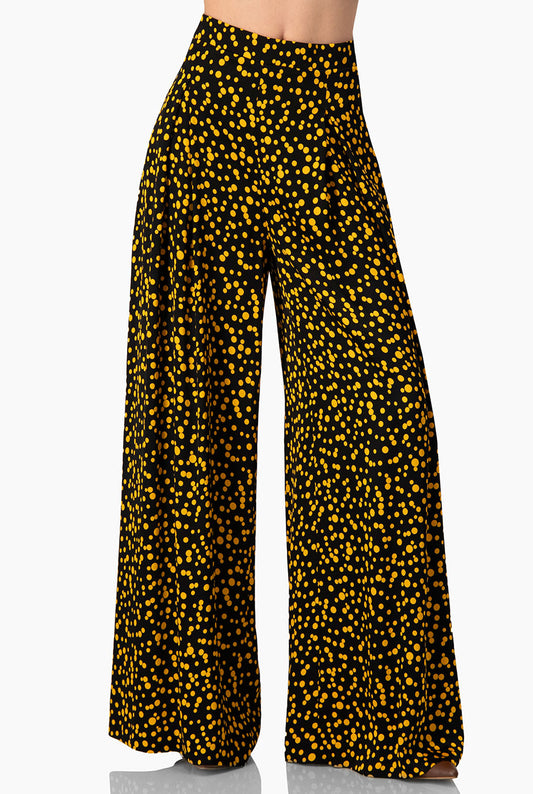 Pantalón negro de lunares amarillos con pierna amplia
