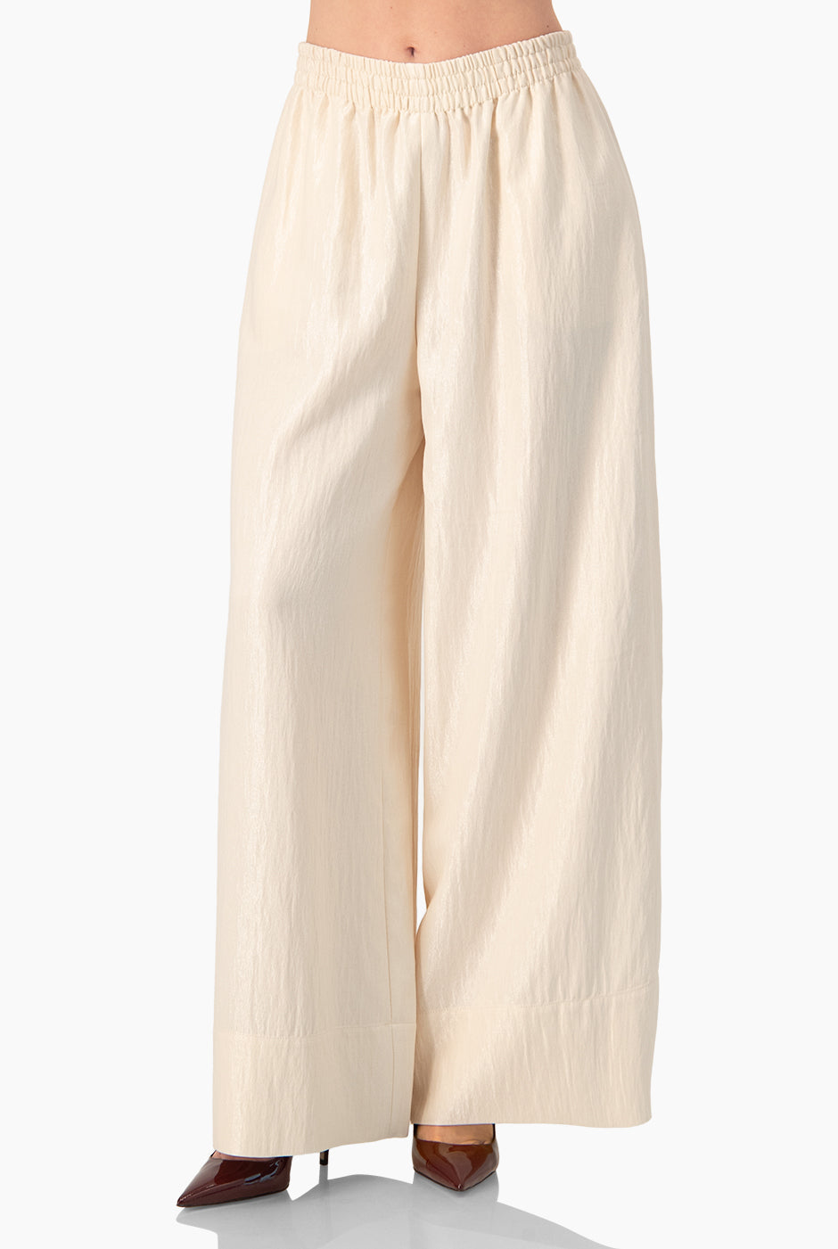 Pantalón amplio natural con cintura elástica y dobladillo suelto