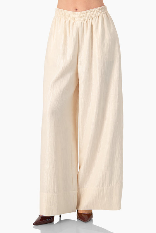 Pantalón amplio natural con cintura elástica y dobladillo suelto
